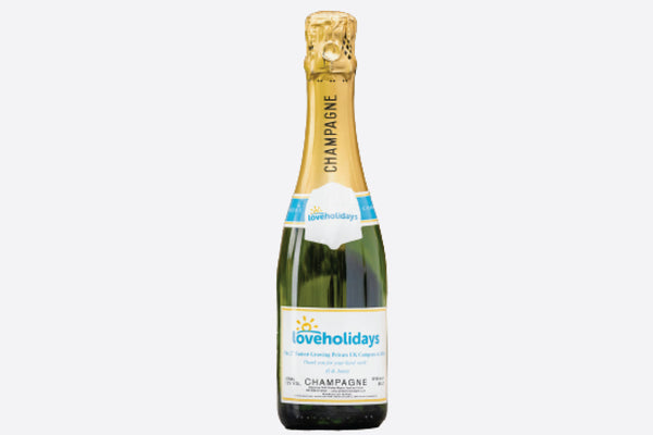 Half bottle of corporate branded champagne gift wrapped with card
